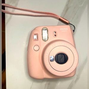 Pink Instax 9 Polaroid camera